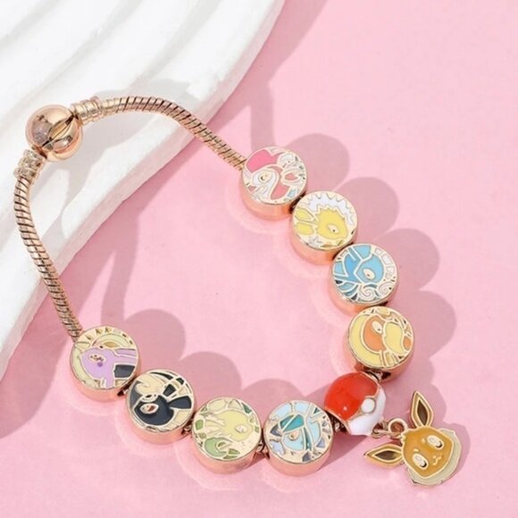 ⭐️NEW⭐️ Gold Plated & Enameled Pokémon Eevee Eeveelution Themed Charm Bracelet - Picture 3 of 8